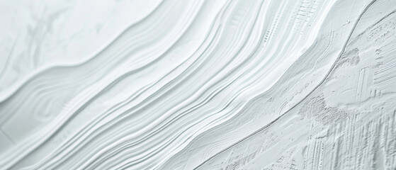 Smooth, rippled textures of white material, creating an abstract and calming pattern.