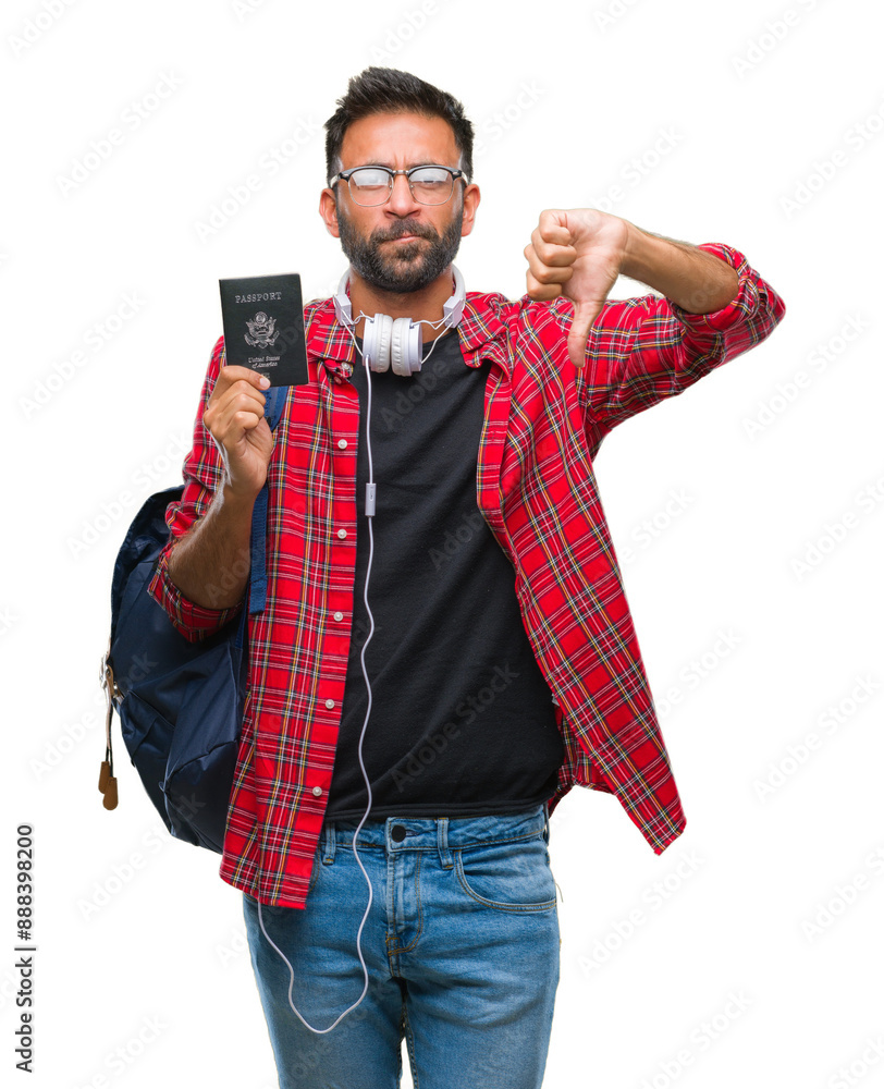 Sticker Adult hispanic student man holding passport of america over isolated background with angry face, negative sign showing dislike with thumbs down, rejection concept