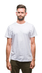 Fototapeta premium Young handsome man over isolated background skeptic and nervous, frowning upset because of problem. Negative person.