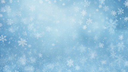 Light blue winter background with various white snowflakes and soft glowing particles