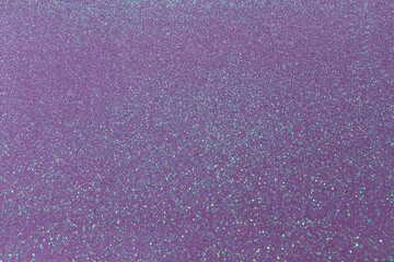 Beautiful glitters shiny texture purple color paper with sparkles, close-up