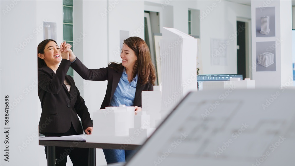Aufkleber architects doing high five gesture after finishing blueprints, feeling happy about translating measu