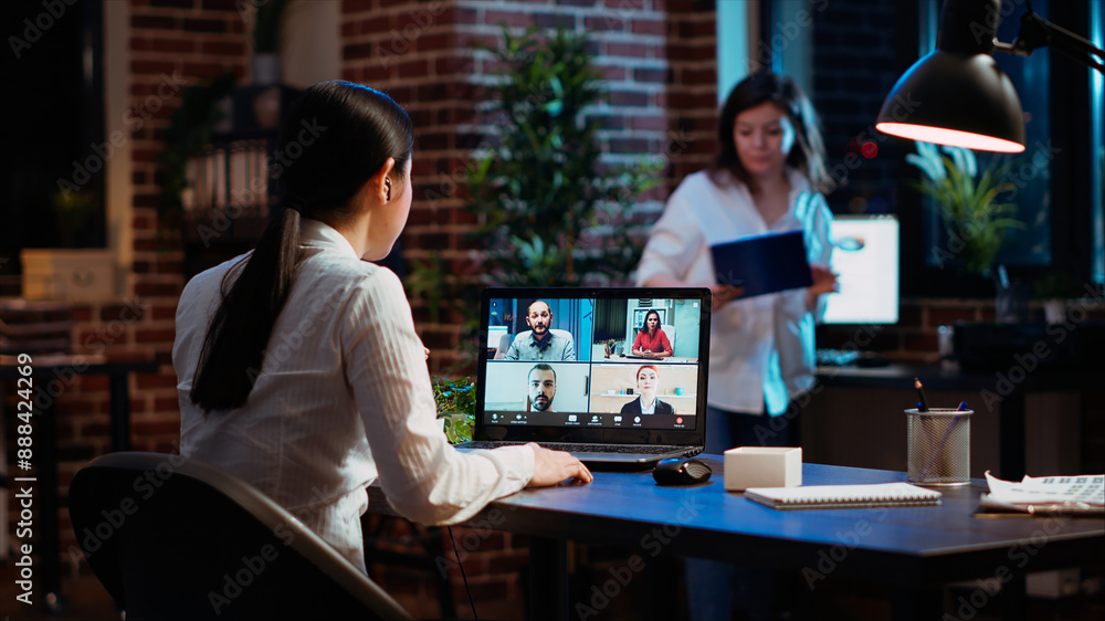 Poster manager organizing company meeting on videocall, discussing with employees working remotely from hom