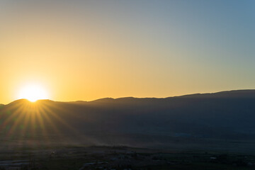 Sunlights shine from behind the mountain, beautiful scenery, natural concept