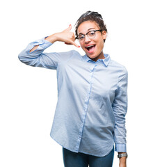 Young braided hair african american business girl wearing glasses over isolated background smiling doing phone gesture with hand and fingers like talking on the telephone. Communicating concepts.