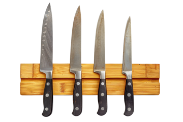 A bamboo magnetic knife holder with four kitchen knives securely attached, offering a practical and stylish solution for kitchen organization, isolated on a transparent background. PNG File,