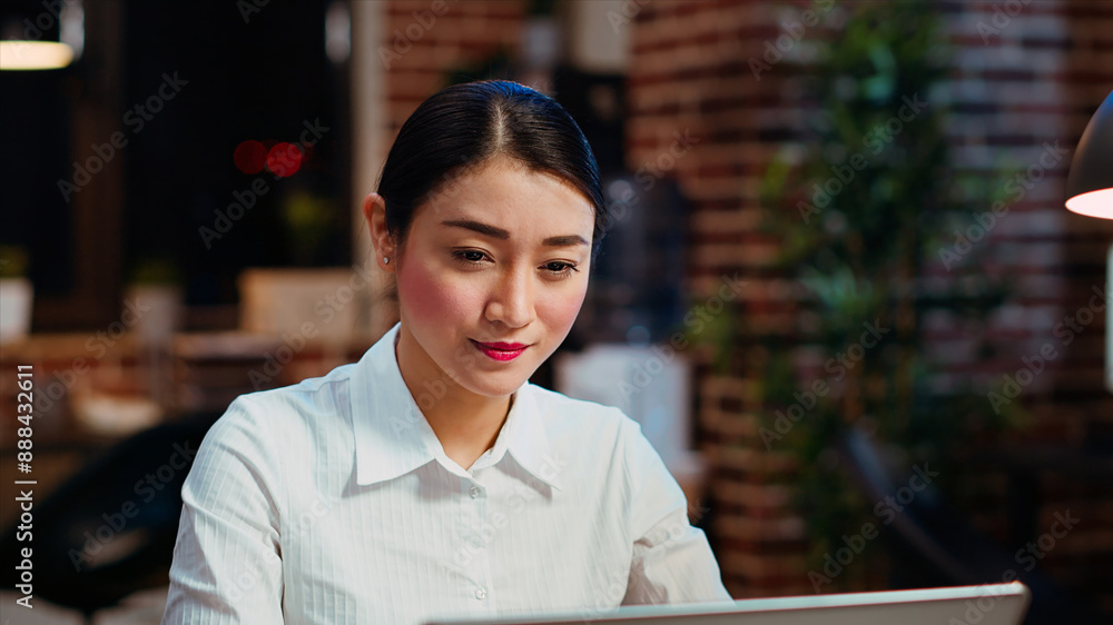 Aufkleber zoom in on smiling businesswoman inputting financial data on laptop and analyzing sales report to pl