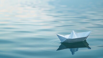 Obraz premium Paper boat floats peacefully on calm blue water