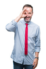 Middle age hoary senior business man wearing red tie over isolated background doing ok gesture with hand smiling, eye looking through fingers with happy face.