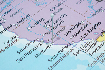 Close up to a Monterrey city with a white pin needle into United States of America country political map 