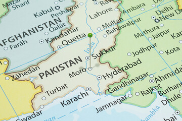 Close up to a Moro city with a green pin needle into Pakistan country political map 