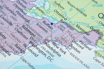 Close up to a New York city with a blue pin needle into United States of America country political map 