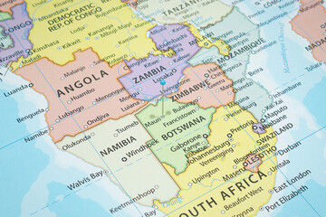 Close up to a Maun city with a light blue pin needle into Botswana country political map 