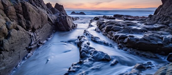 Serene Sunset Over Rocky Coastline