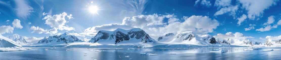 A Panoramic View of Antarctic Mountains with a Bright Blue Sky