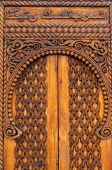 Eastern Charm: Detail of an Ancient Door with Arabic Inscription.