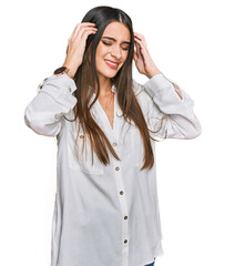 Young beautiful woman wearing casual white shirt with hand on head, headache because stress. suffering migraine.