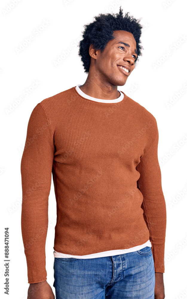 Sticker Handsome african american man with afro hair wearing casual clothes looking away to side with smile on face, natural expression. laughing confident.