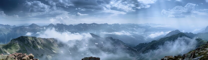 Naklejka premium Misty Mountain Peaks in the Light of Day