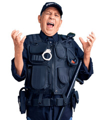 Senior handsome man wearing police uniform crazy and mad shouting and yelling with aggressive expression and arms raised. frustration concept.
