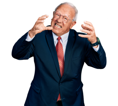 Senior man with grey hair wearing business suit and glasses shouting frustrated with rage, hands trying to strangle, yelling mad