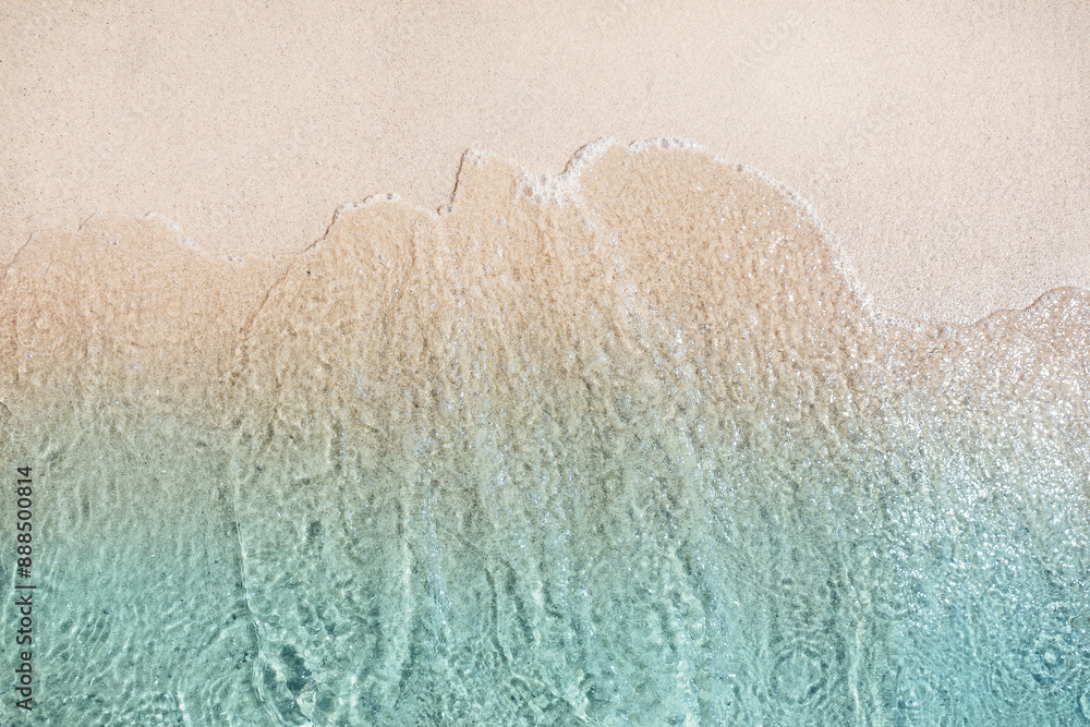 Poster Sea waves rolling on beautiful sandy beach, top view. Summer vacation