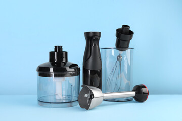 Hand blender kit on light blue background