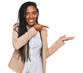 African american woman wearing business jacket amazed and smiling to the camera while presenting with hand and pointing with finger.