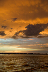 Sun setting over the Gulf of Mexico from the point of view of a viewer on a boat. 