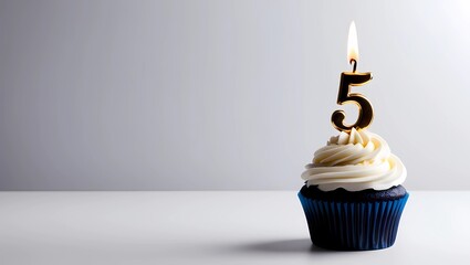 Gold Candle Number 5 on Blue Cupcake with Gray Background
