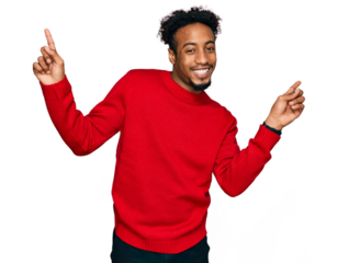 Young african american man with beard wearing casual winter sweater smiling confident pointing with fingers to different directions. copy space for advertisement