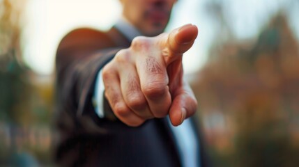 Photo of a businessman pointing a finger at you Businessman points with finger