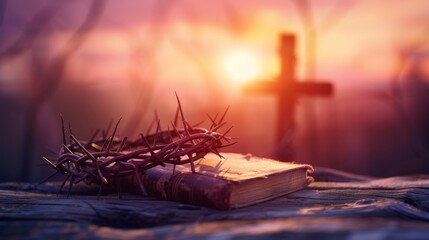 Photograph of a crown of thorns, a wooden cross and the Holy Bible at sunset. christian background