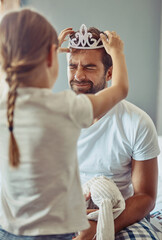 Playing, tiara and dad with kid in home for bonding, happy relationship and parenting in bedroom....