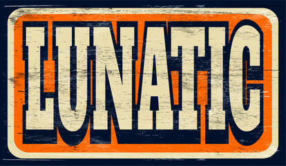 Aged vintage lunatic sign on wood