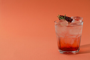 Red cocktail with fresh pomegranate on the table
