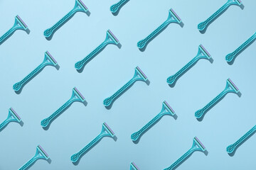 Razors for shaving on a blue background