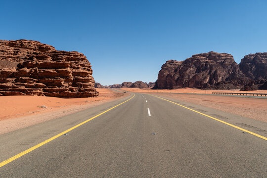 Tabuk, Saudi Arabia: The stunning red desert road near Tabuk in northwestern part of Saudi Arabia in the middle east on a sunny day