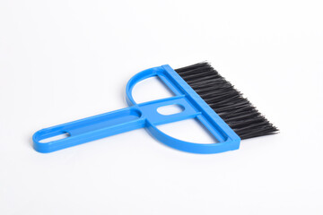 Small blue broom isolated on white background