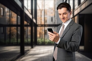 Happy confident business man standing in office