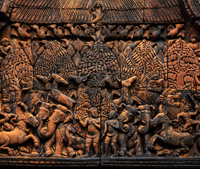 Pediment containing bas relief carved in red sandstone of ancient figures of animals at Banteay Srei - citadel of women and beaut - Hindu temple dedicated to god Shiva and Parvati, Siem Reap, Cambodia