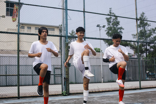 Sports Group, Soccer And Team Doing Physical Workout And Warming Legs Up Before Football Game - Powered by Adobe