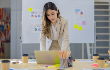 Portrait of female financial advisor in modern office. Working with commitment and confidence.