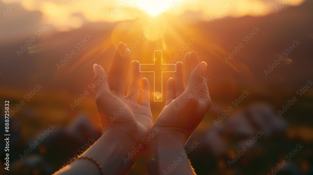 Wall mural Hands with christian cross symbol and sunrise in background.