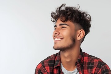 Fototapeta premium Side smiling Brazilian man alone on white background