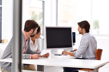 Making sure we are all on the same page. Portrait of a diverse group of businesspeople sitting in an office.