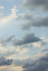 It's a blue sky with atmospheric puffy clouds.