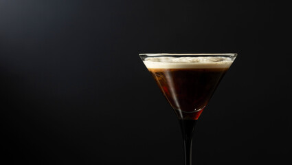 Espresso Martini drink on a black background.