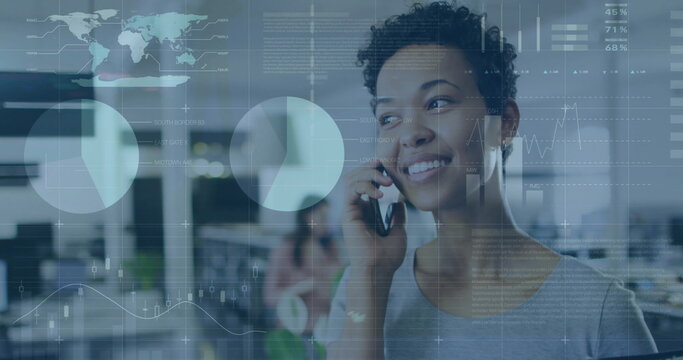Image of infographic interface over smiling biracial woman talking on cellphone in office