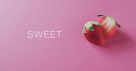 Image of sweet text over halved strawberry on pink background